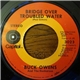 Buck Owens And The Buckaroos - Bridge Over Troubled Water / (I'm Goin') Home